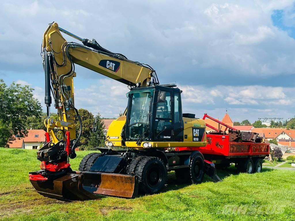 CAT M 315 D Pelle sur pneus
