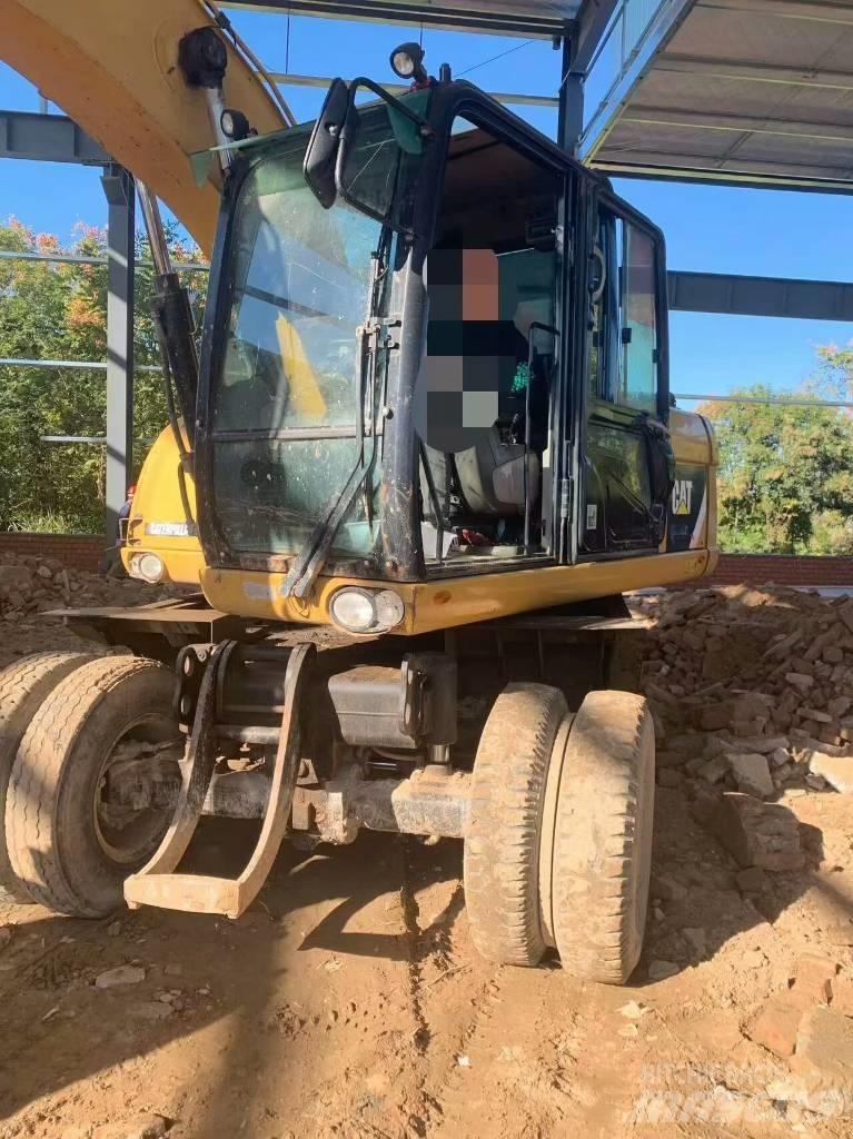CAT 315 D Pelle sur pneus