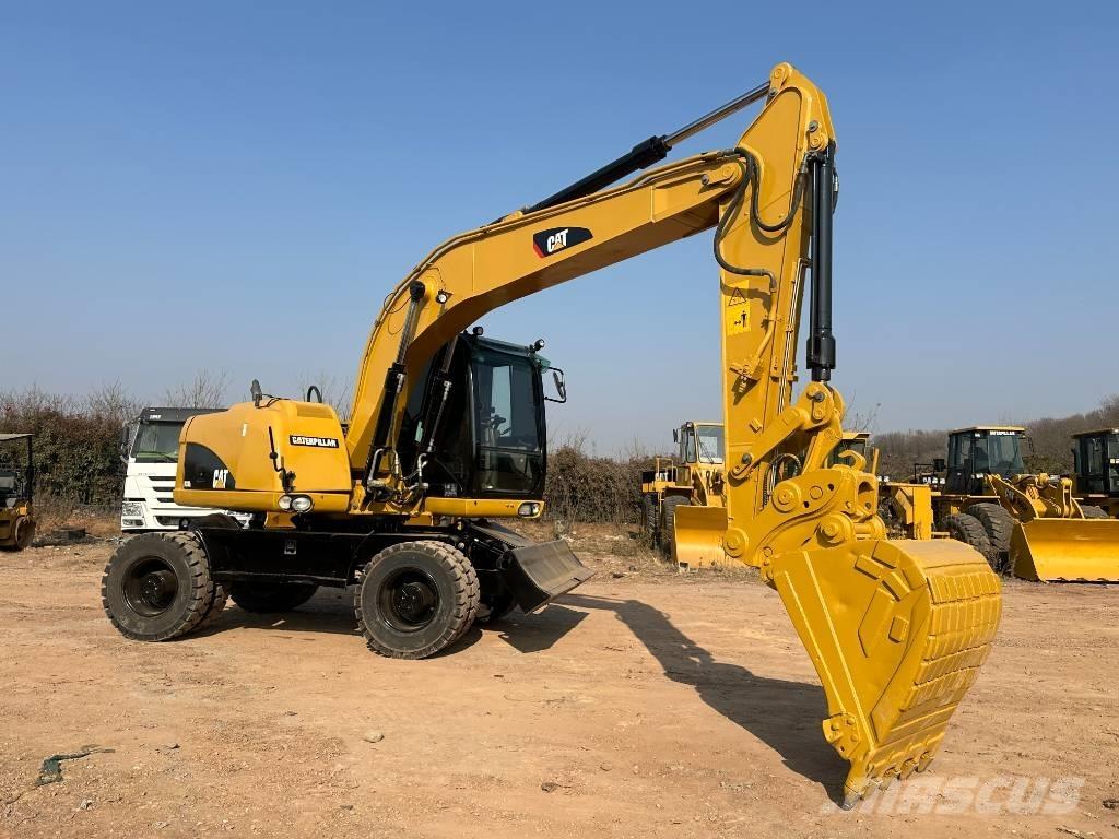 CAT M 320D Pelle sur pneus