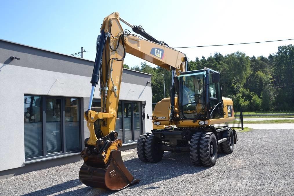 CAT M 315 D Pelle sur pneus
