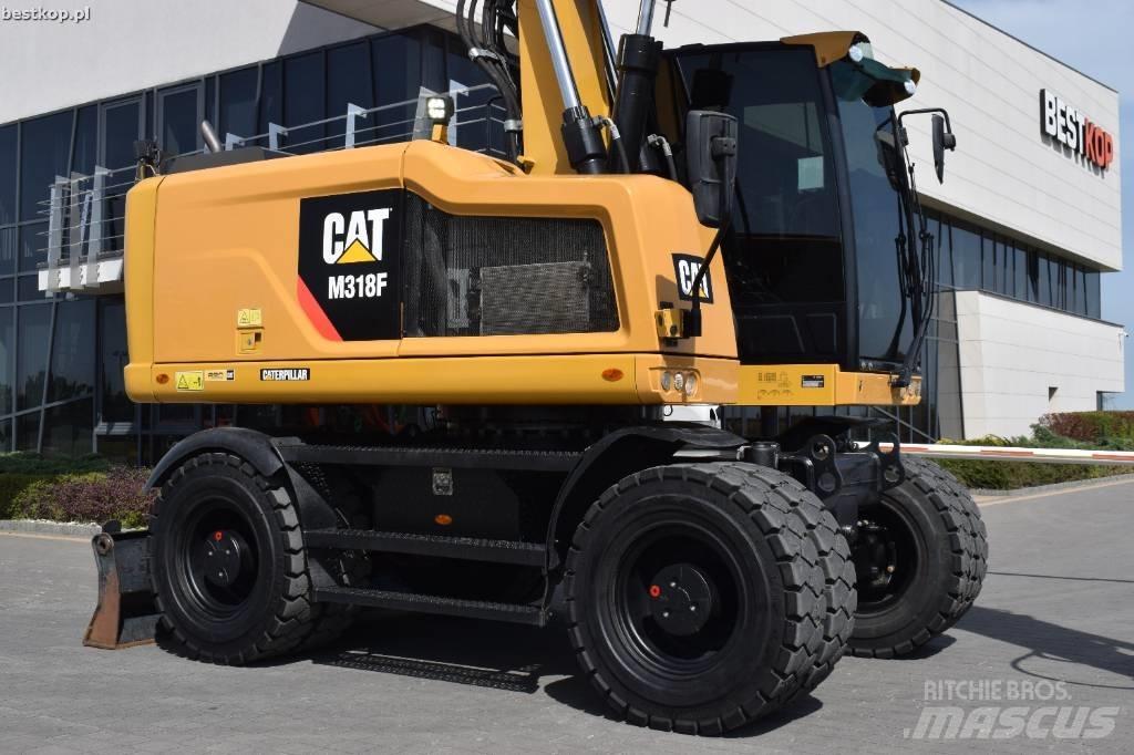CAT M 318 F Pelle sur pneus
