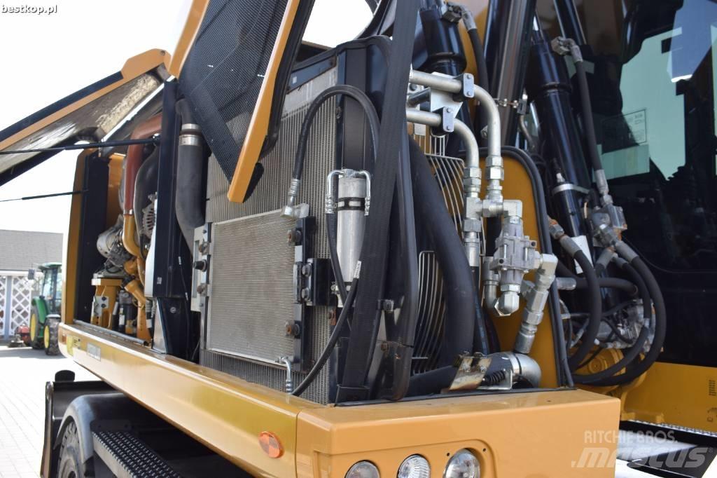 CAT M 318 F Pelle sur pneus