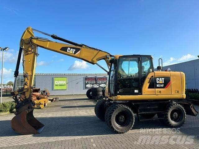 CAT M 314 F Pelle sur pneus