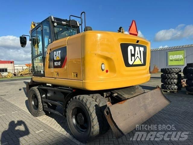 CAT M 314 F Pelle sur pneus