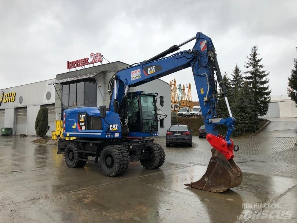 CAT M318F Pelle sur pneus