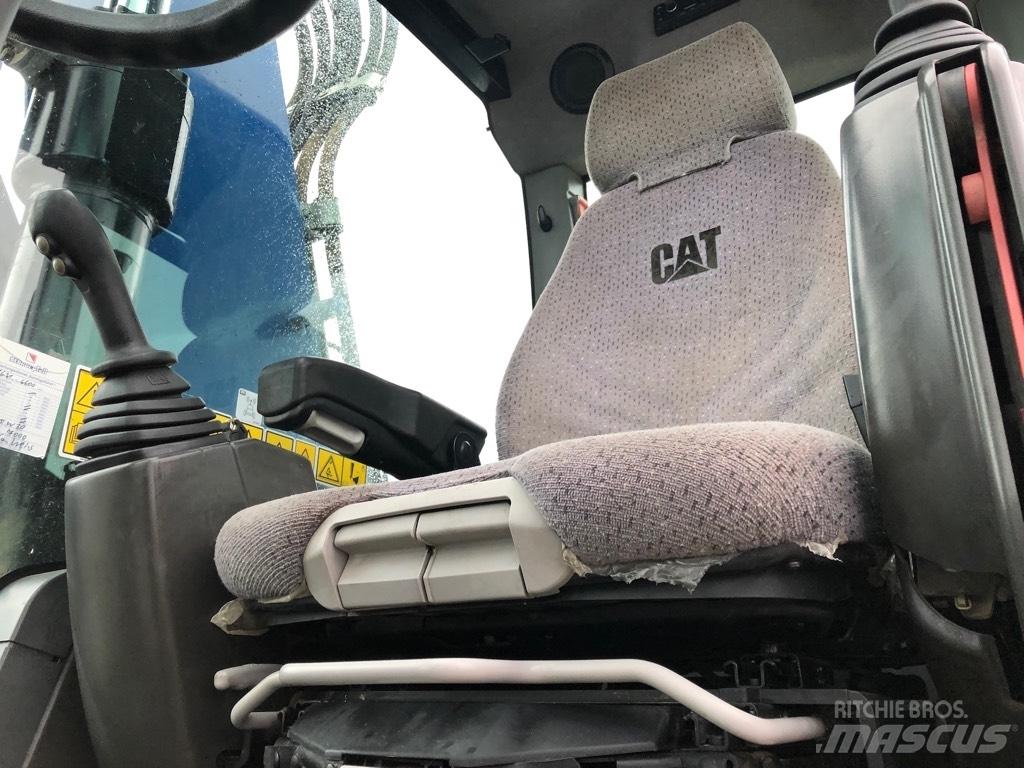 CAT M318F Pelle sur pneus