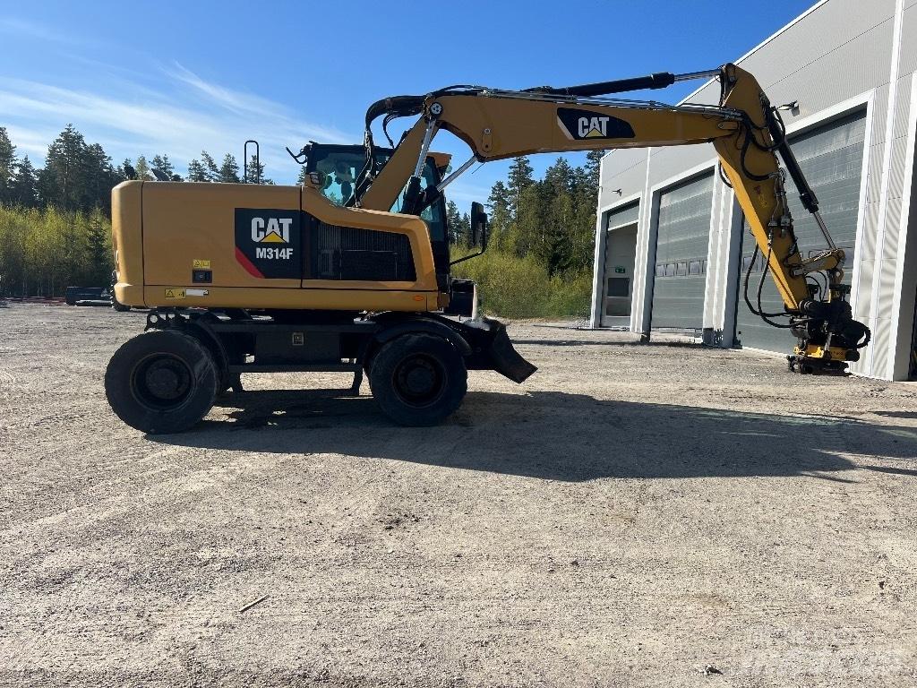 CAT M314F Pelle sur pneus