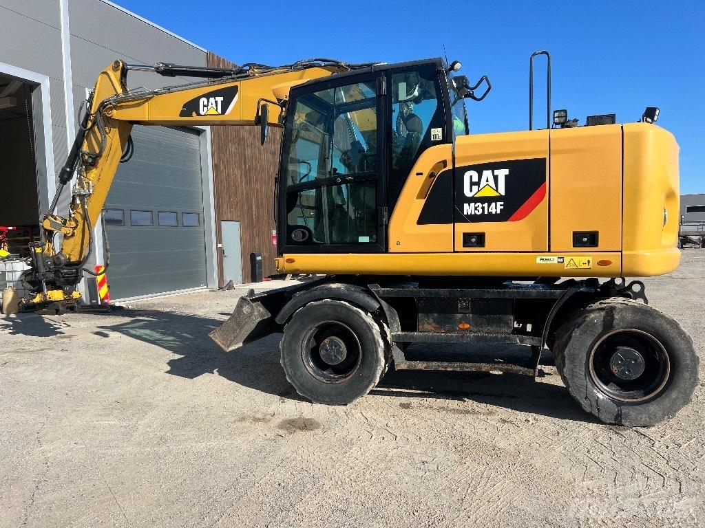 CAT M314F Pelle sur pneus