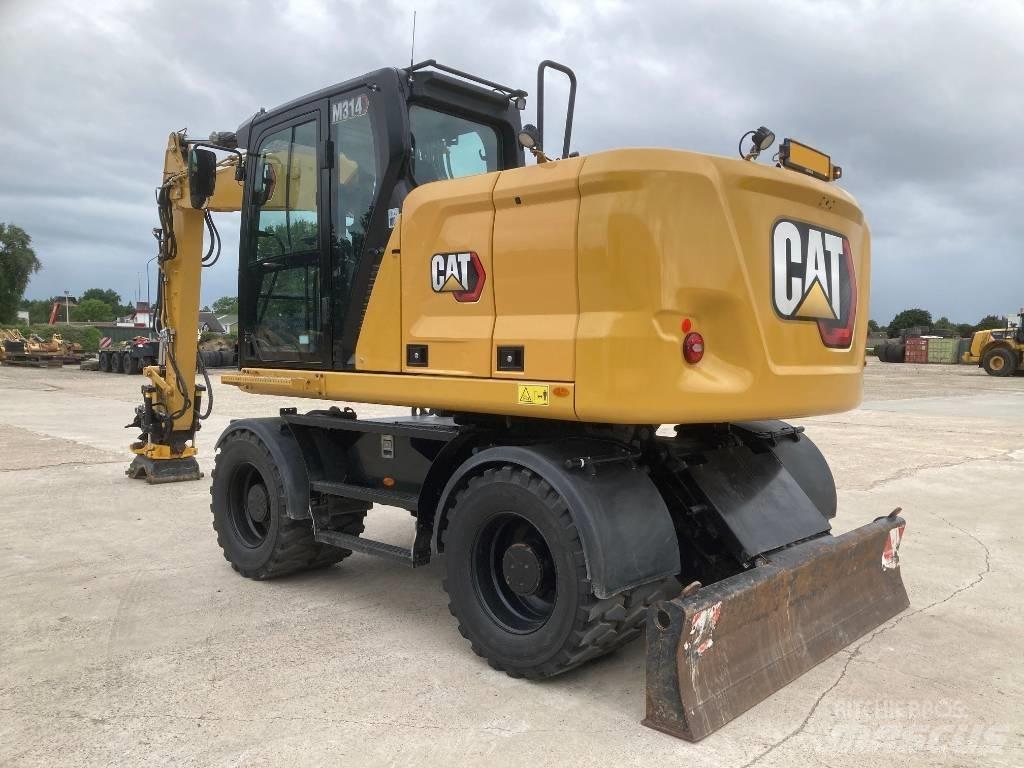 CAT M314 Pelle sur pneus