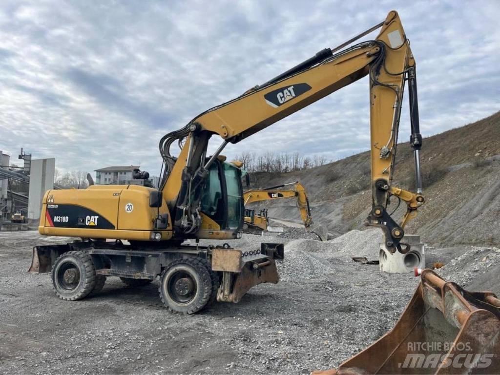 CAT M318D Pelle sur pneus