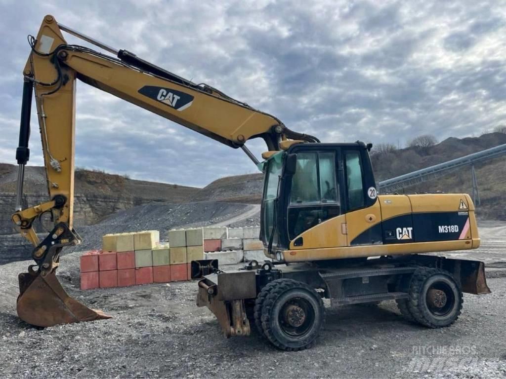 CAT M318D Pelle sur pneus