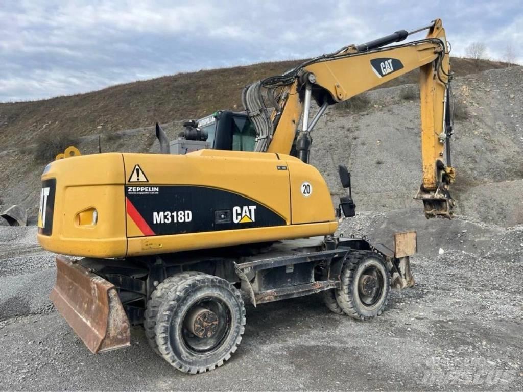 CAT M318D Pelle sur pneus