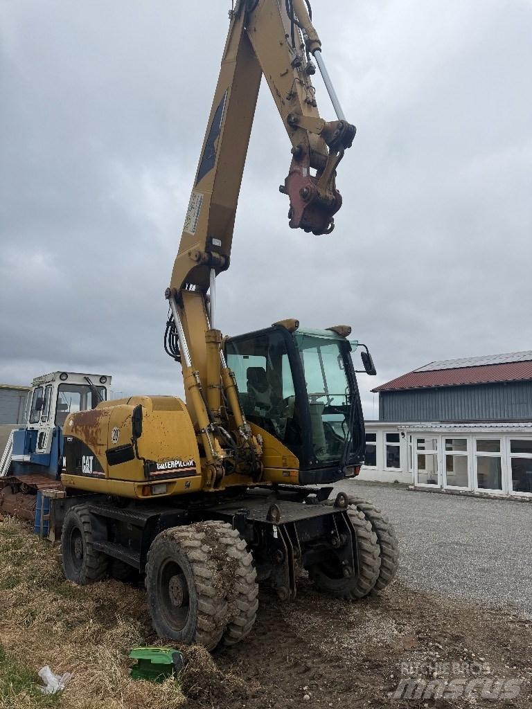 CAT M 313 C Pelle sur pneus