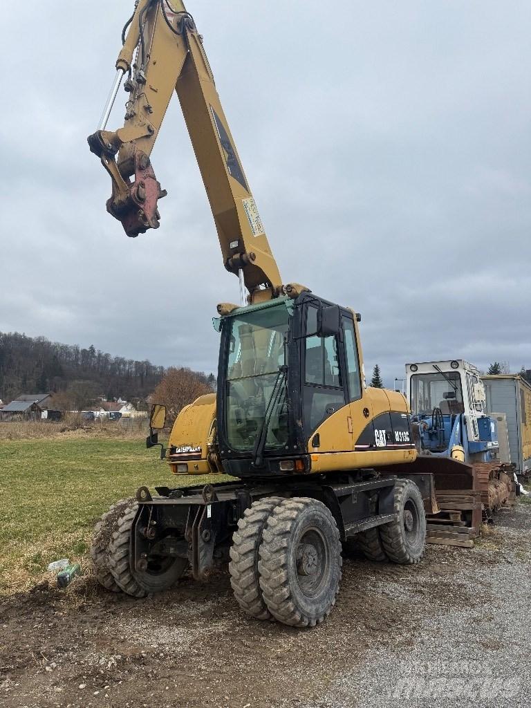 CAT M 313 C Pelle sur pneus