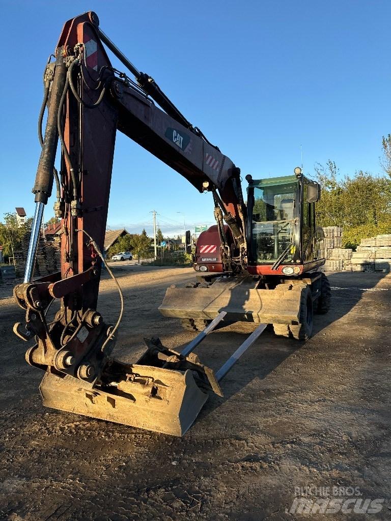 CAT 313 D Pelle sur pneus