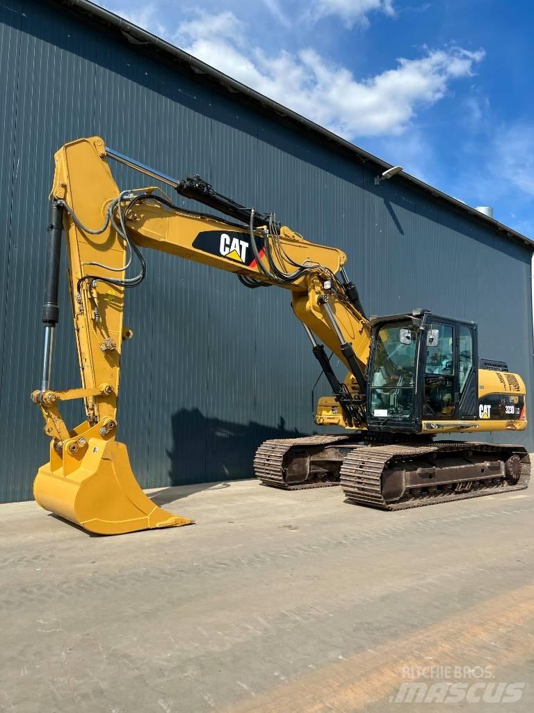 CAT M316C Pelle sur pneus