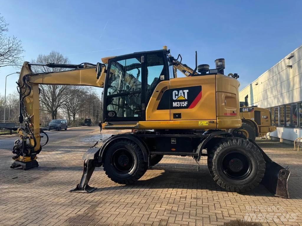 CAT M315F Pelle sur pneus