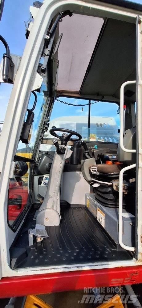 Takeuchi TB 295W Pelle sur pneus