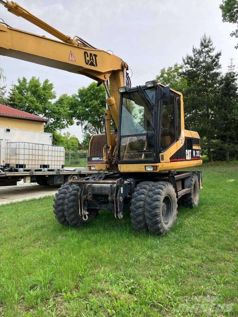 CAT M 312 Pelle sur pneus