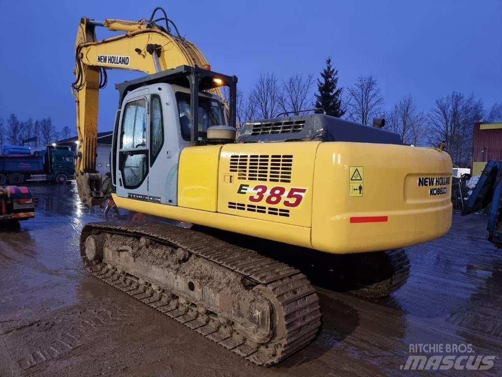 New Holland E 385 Pelle sur chenilles