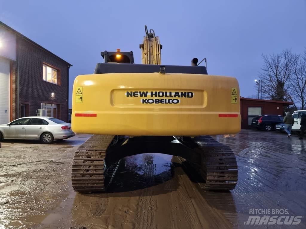 New Holland E 385 Pelle sur chenilles