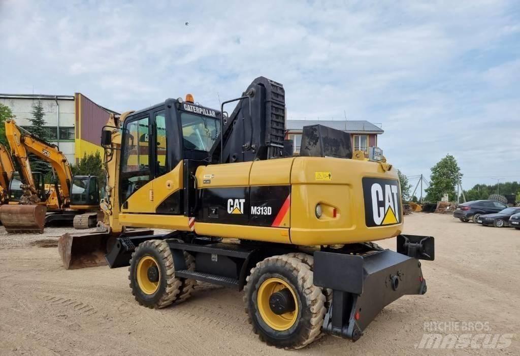 CAT M313 D Pelle sur pneus