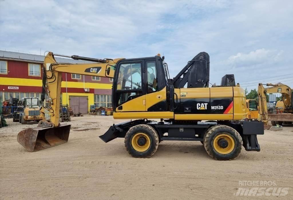 CAT M313 D Pelle sur pneus