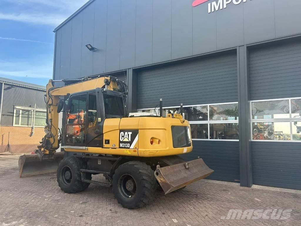 CAT M313D Pelle sur pneus