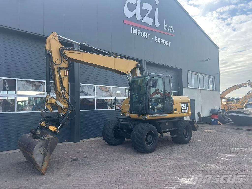 CAT M313D Pelle sur pneus