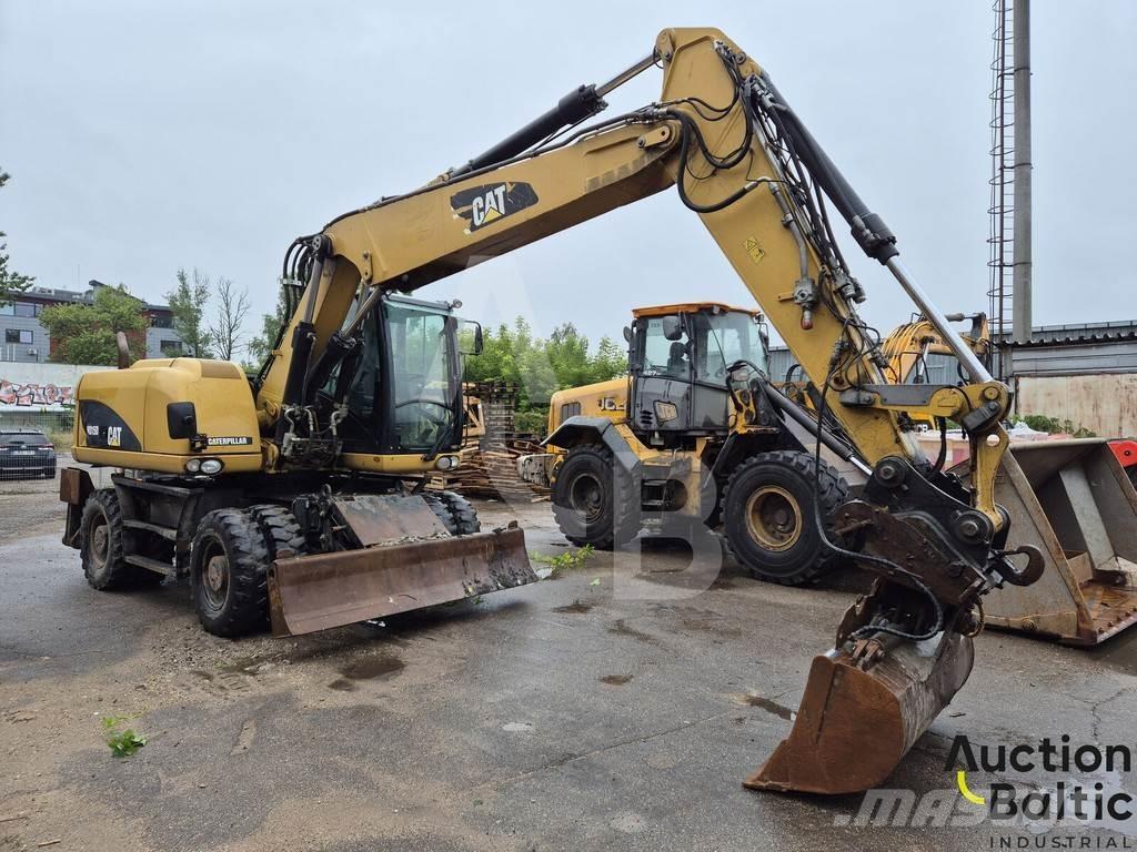 CAT M 315 D Pelle sur pneus