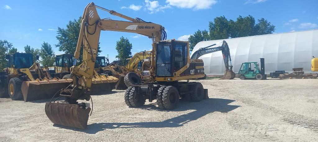 CAT M 315 Pelle sur pneus