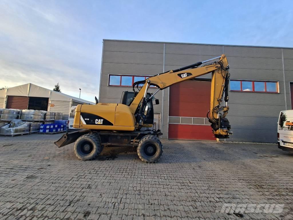 CAT M 313 D Pelle sur pneus