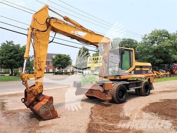 CAT M320 Pelle sur pneus