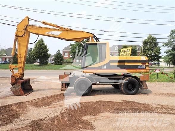 CAT M320 Pelle sur pneus