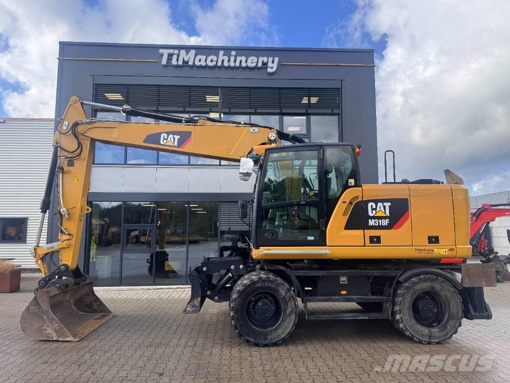 CAT M 318 F Pelle sur pneus