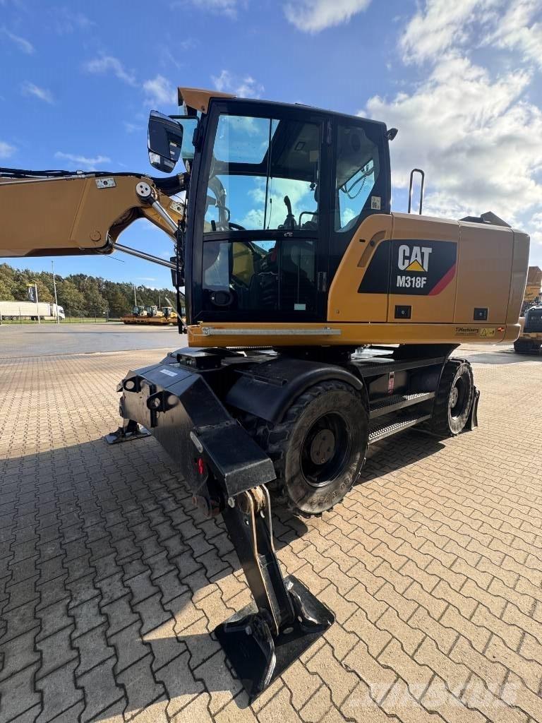 CAT M 318 F Pelle sur pneus