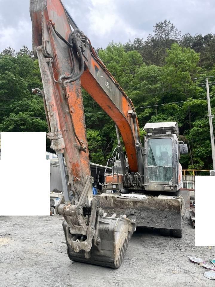 Doosan DX 210 W Pelle sur pneus