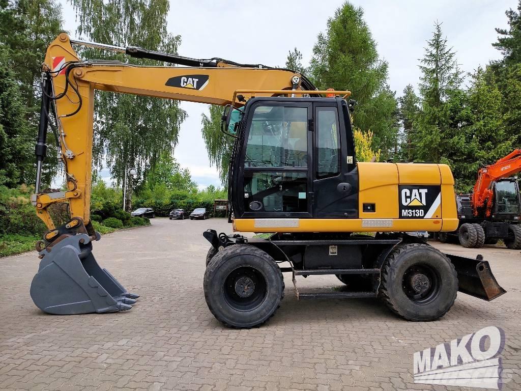 CAT M 313 D Pelle sur pneus