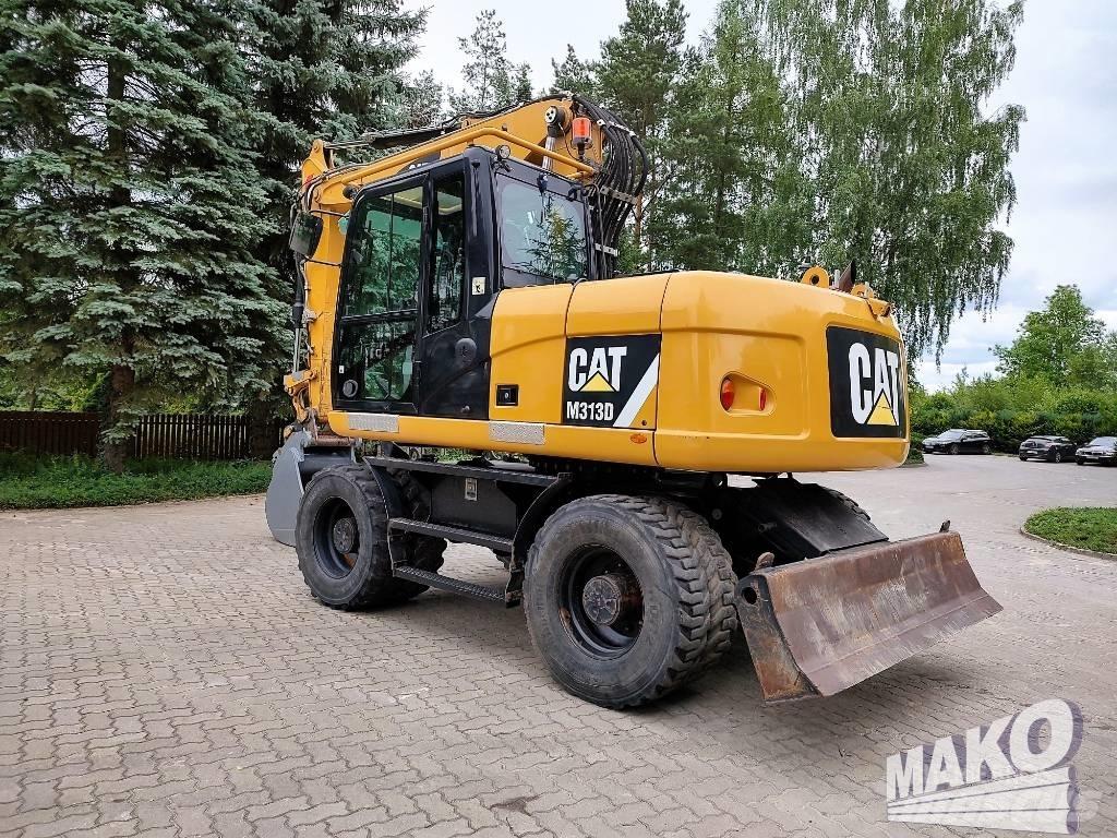 CAT M 313 D Pelle sur pneus