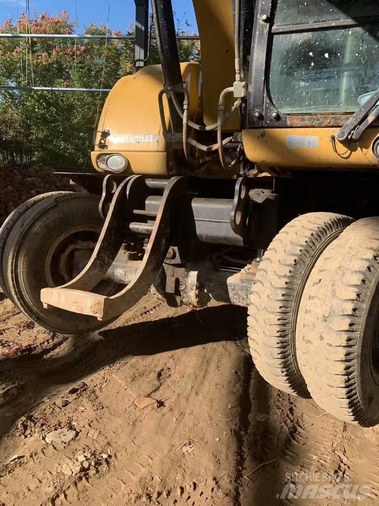 CAT 315 D Pelle sur pneus