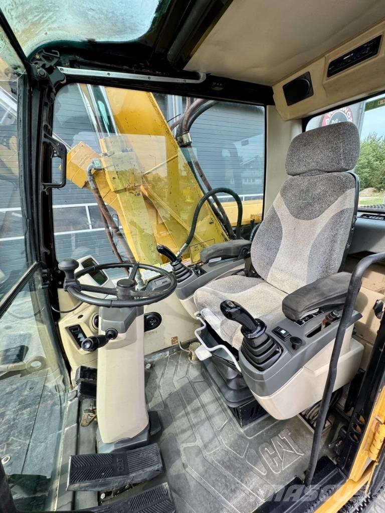CAT M 318 C Pelle sur pneus