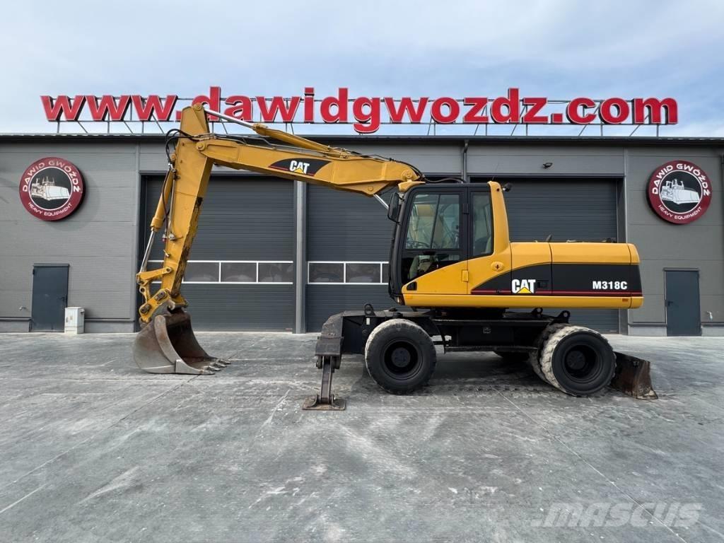CAT M 318 C Pelle sur pneus