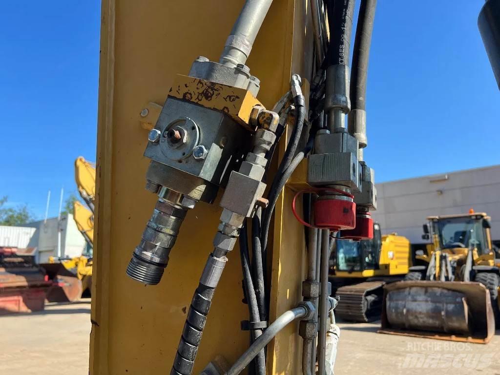 CAT M316D Pelle sur pneus