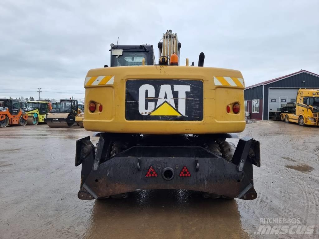 CAT M 315 D II Pelle sur pneus