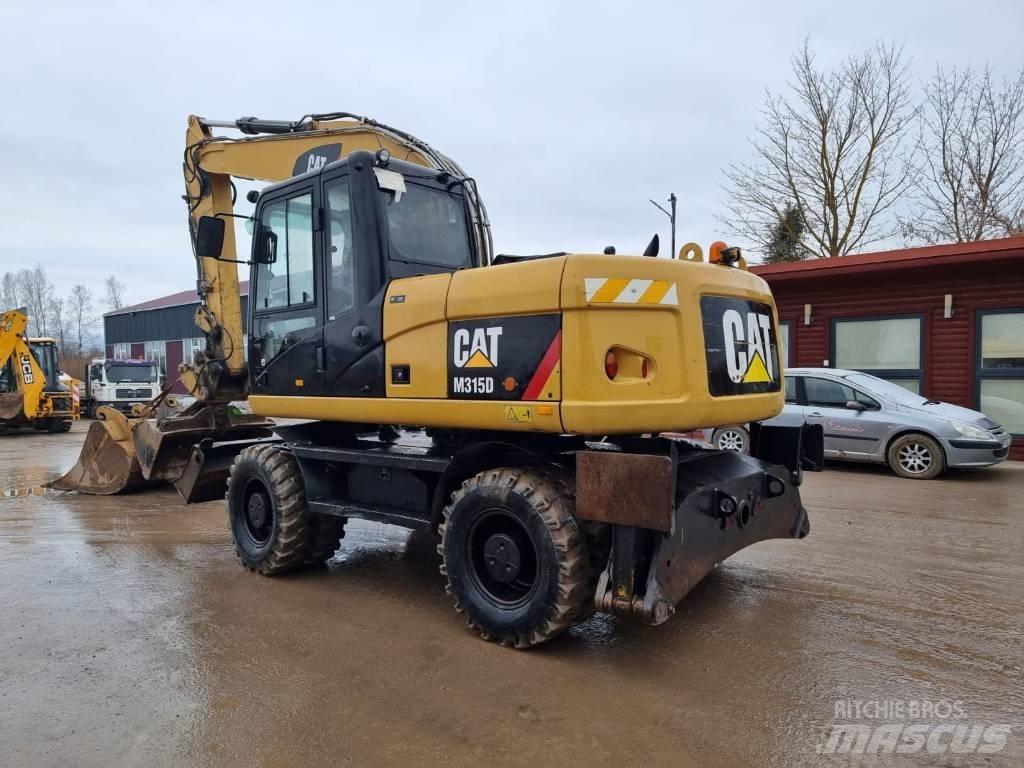 CAT M 315 D II Pelle sur pneus