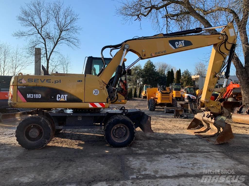 CAT M 318 D Pelle sur pneus
