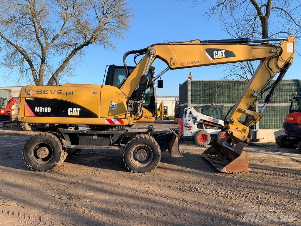 CAT M 318 D Pelle sur pneus
