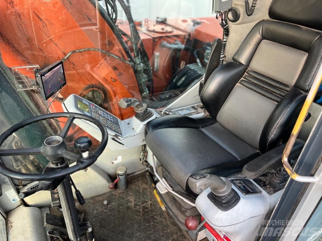 Atlas 1505 M Pelle sur pneus