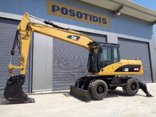 CAT M 318 D Pelle sur pneus