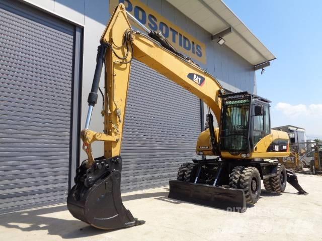 CAT M 318 D Pelle sur pneus